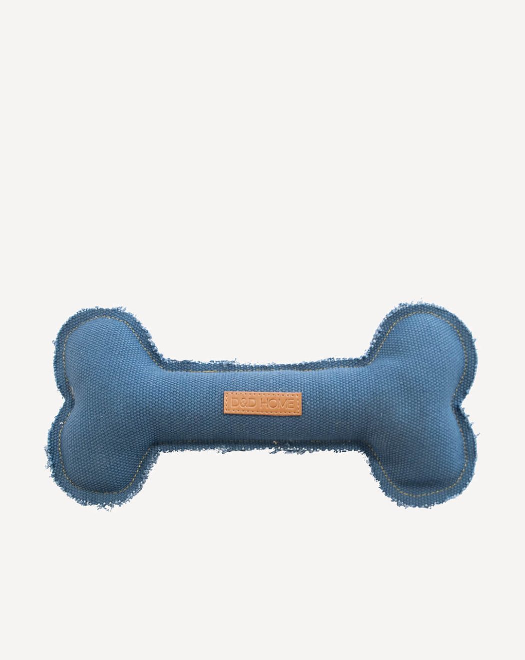 Hundespielzeug blauer Knochen aus Stoff. Die Kanten sind unversäubert.